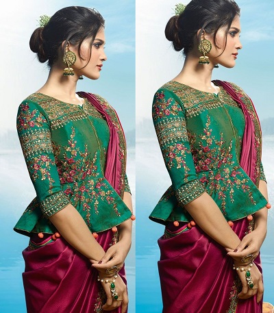 Green detailed embroidered peplum style blouse in silk