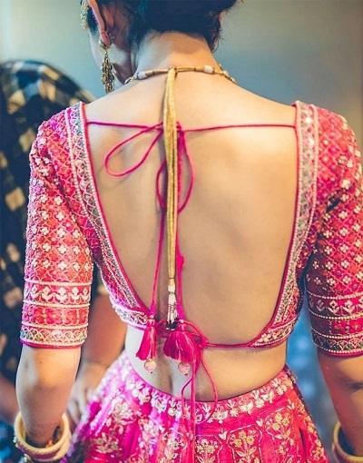 Pink stylish backless blouse for lehenga and silk sarees