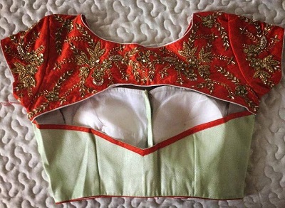 Stylish cutwork padded blouse design for saree