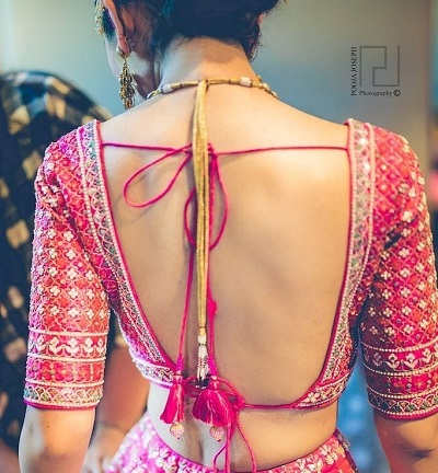 Simple backless blouse pattern with heavy embroidery