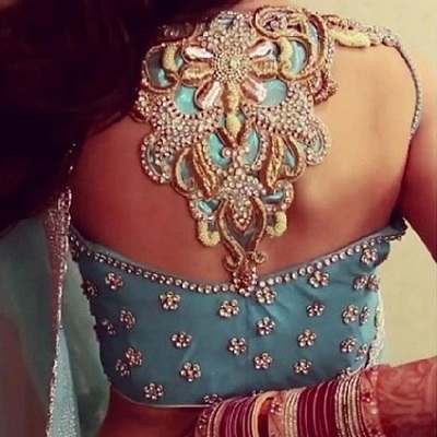 Stylish heavily embellished patch and Stone Work blouse design